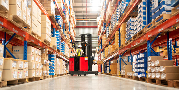LED lights in industrial setting with person driving forklift
